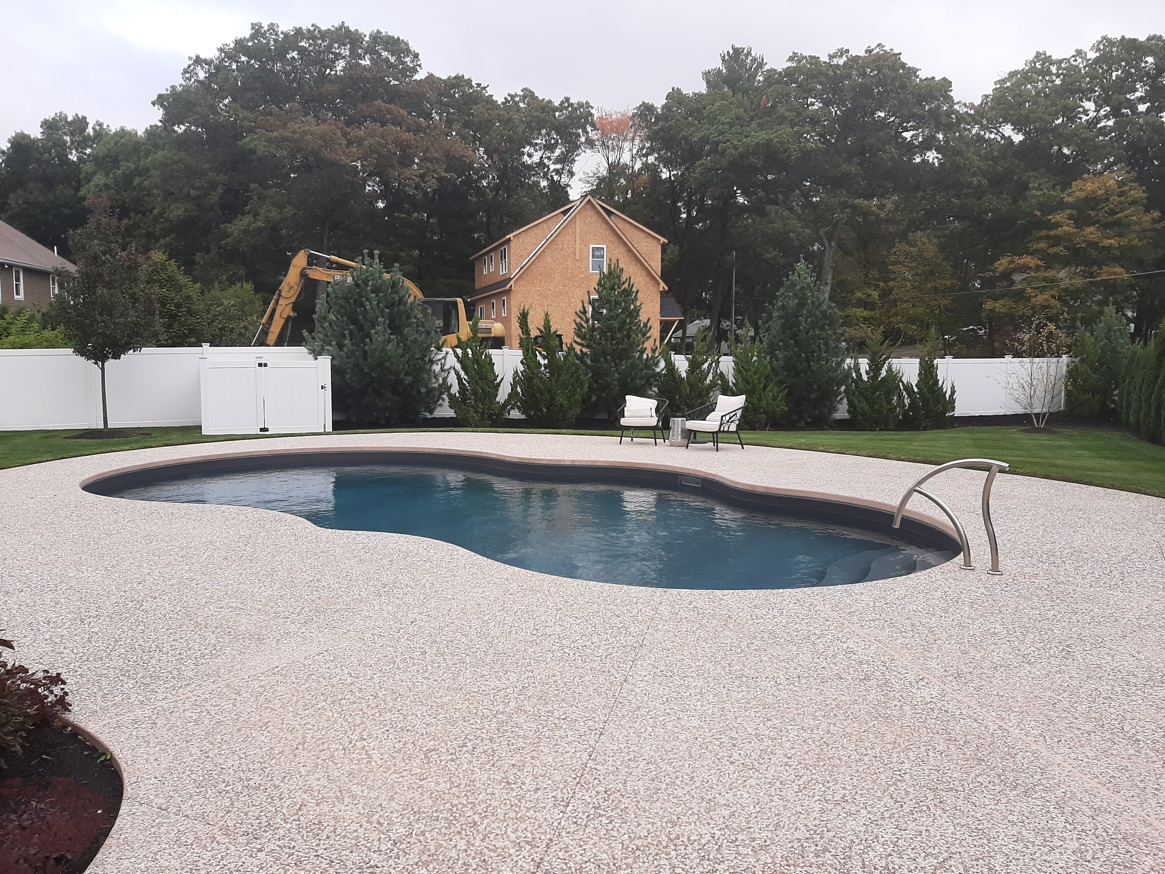 Backyard inground pool installation in Wilmington, MA by Mr. Pools